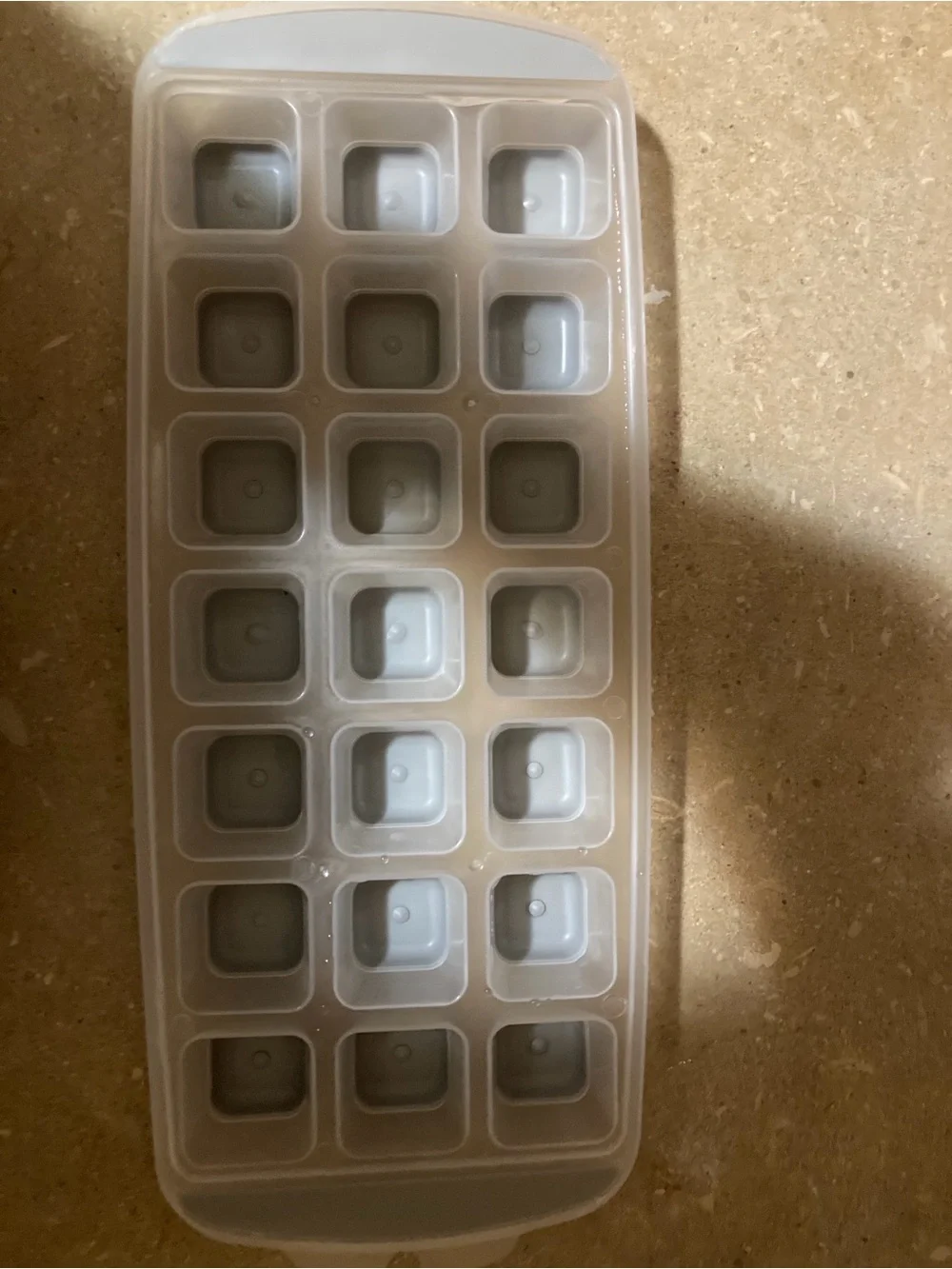 Assorted ice cube trays, scooper and storage
